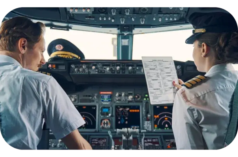 Two pilots in an airliner cockpit reading a checklist against their instruments.