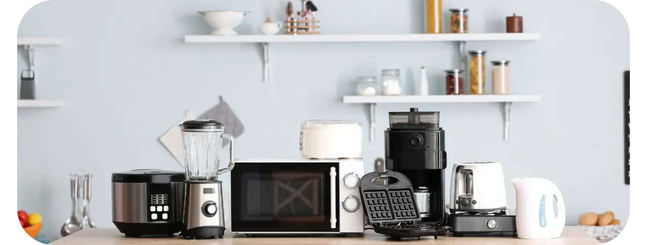 A row of Arzum small household appliances on a kitchen counter: blender, microwave, coffee grinder, waffle maker, toaster and kettle.