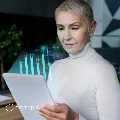 An executive reading a tablet, a bar chart rising out of it