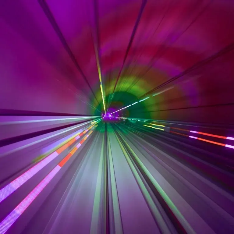 The e-book’s cover artwork: a long-exposure tunnel of magenta and green light streaking towards a point in the distance.