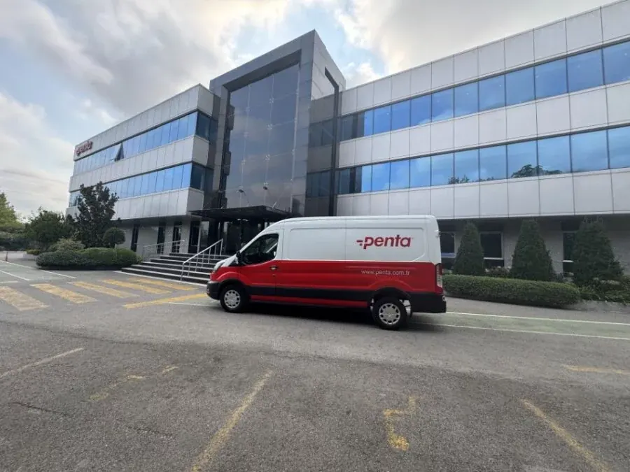 A red and white Penta delivery van parked outside the company’s offices.