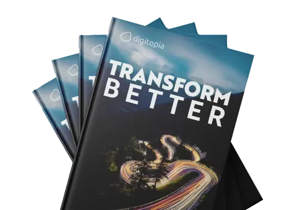 Four copies of the Transform Better e-book fanned out, the mountain road on the cover.