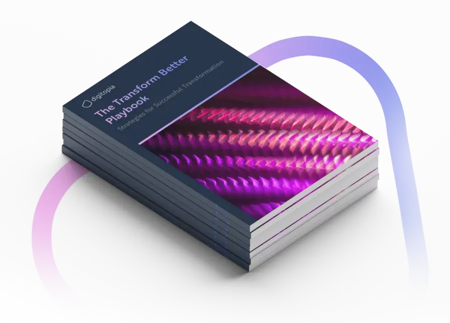 A stack of printed copies of The Transform Better Playbook seen from above.